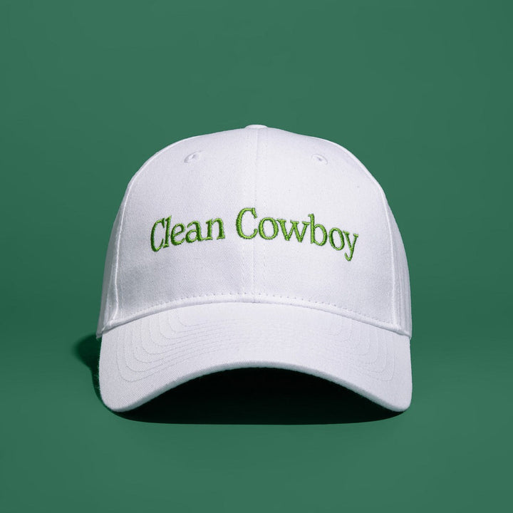 Jackfir Clean Cowboy® Hat in white cotton with green embroidered text shown from front angle