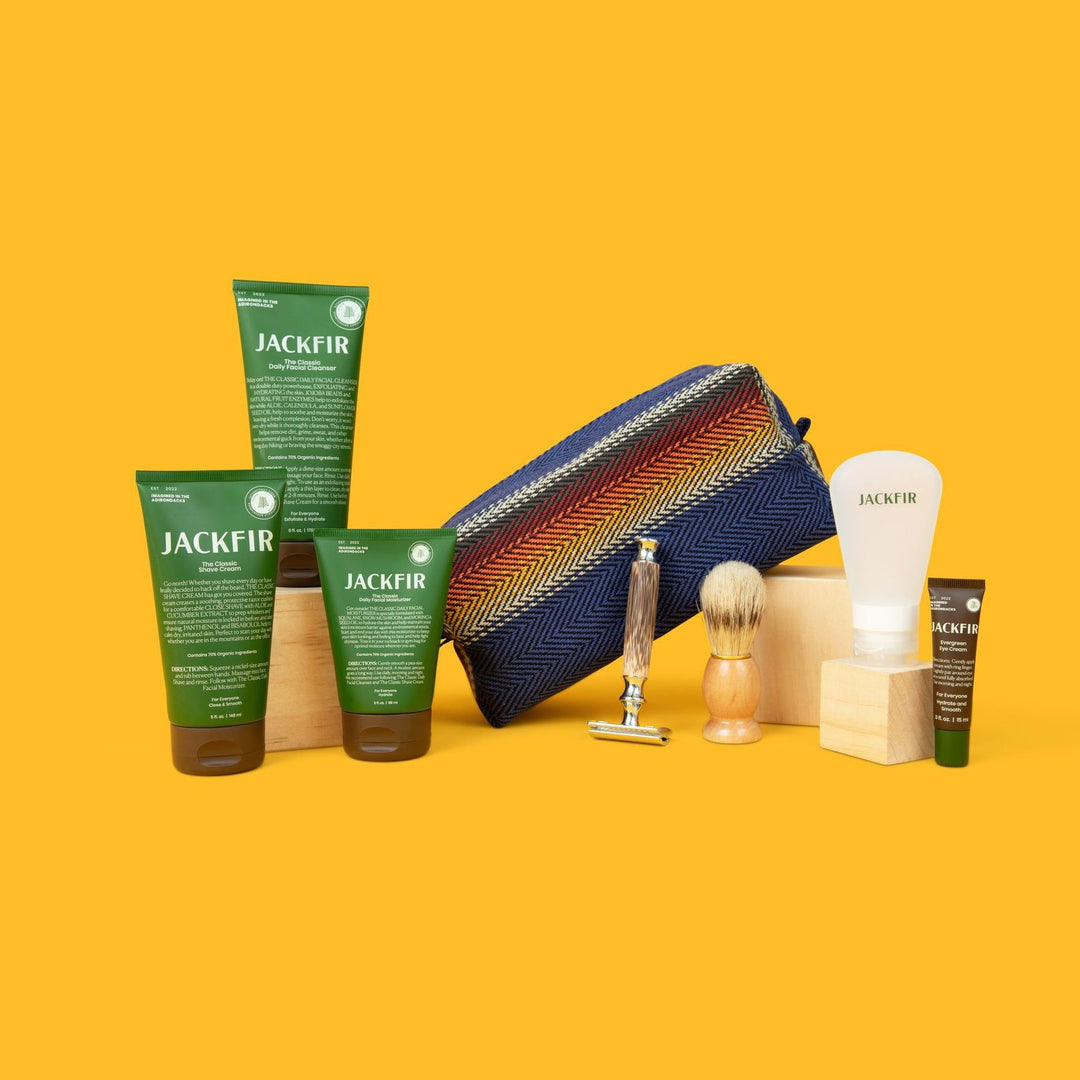 Jackfir The Clean Cowboy® Toiletry Kit with colorful chevron pattern displayed with Jackfir products and shaving tools