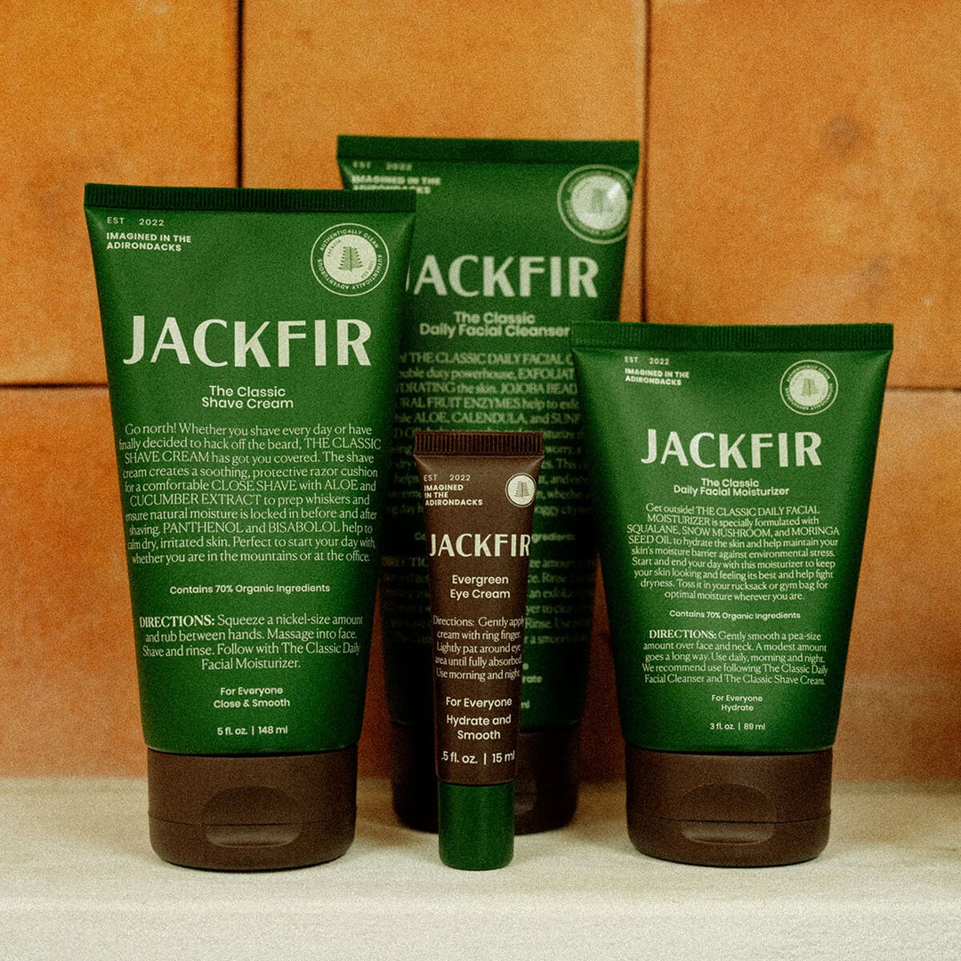 The Complete Jackfir Skincare Set with four green tubes lined up showing shave cream, cleanser, eye cream and moisturizer