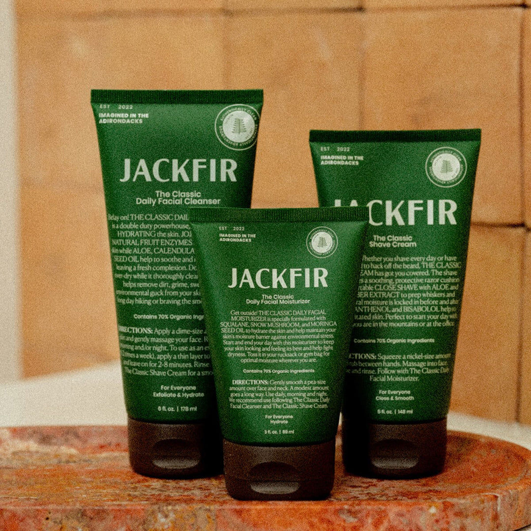 Jackfir The Facekit three green tubes standing upright showing cleanser, moisturizer and shave cream back labels