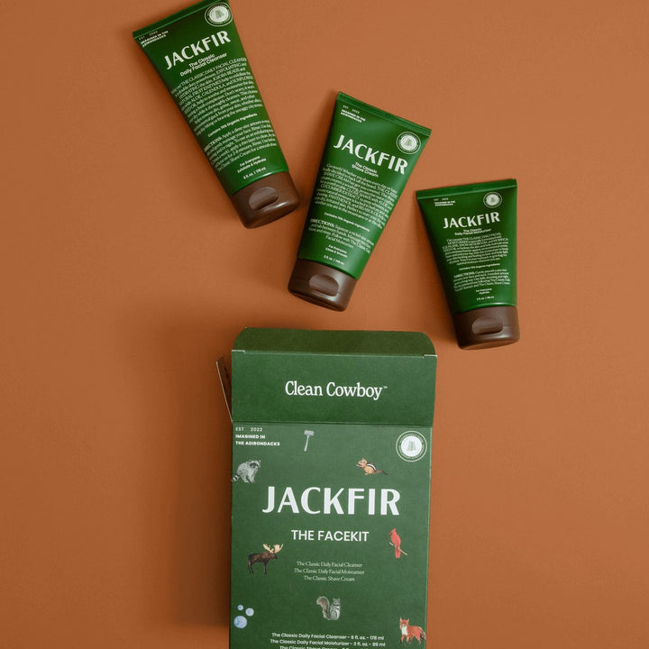 Jackfir The Facekit green box with woodland animal graphics alongside three green product tubes laid flat