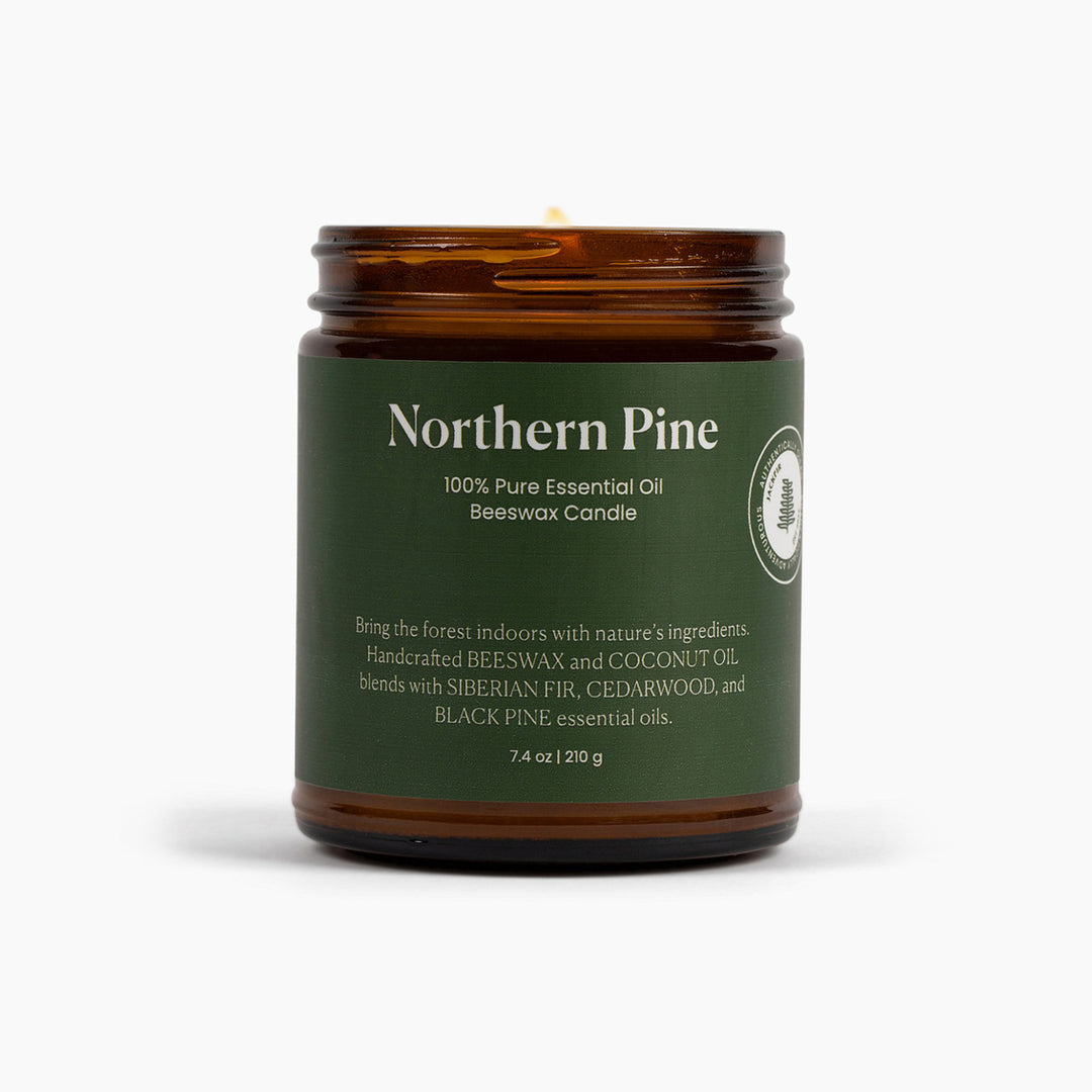 Northern Pine candle with green label on a white background