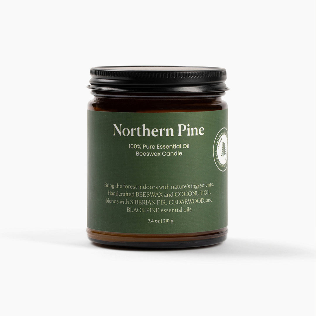 Northern Pine candle jar with green label on a white background