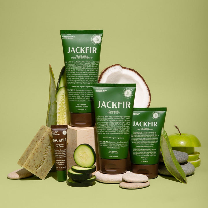 Jackfir The Total Package (All 5 Products) arranged with cucumber slices, coconut, aloe, and soap props