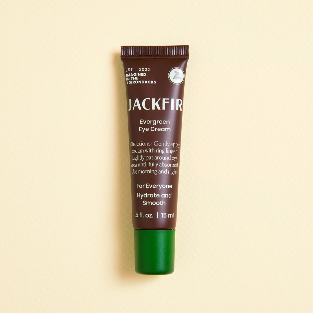 Jackfir The Total Package (All 5 Products) Evergreen Eye Cream tube with brown body and green cap standing upright